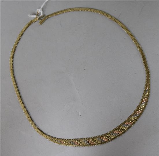 A 9ct three-colour gold brick-link necklace.